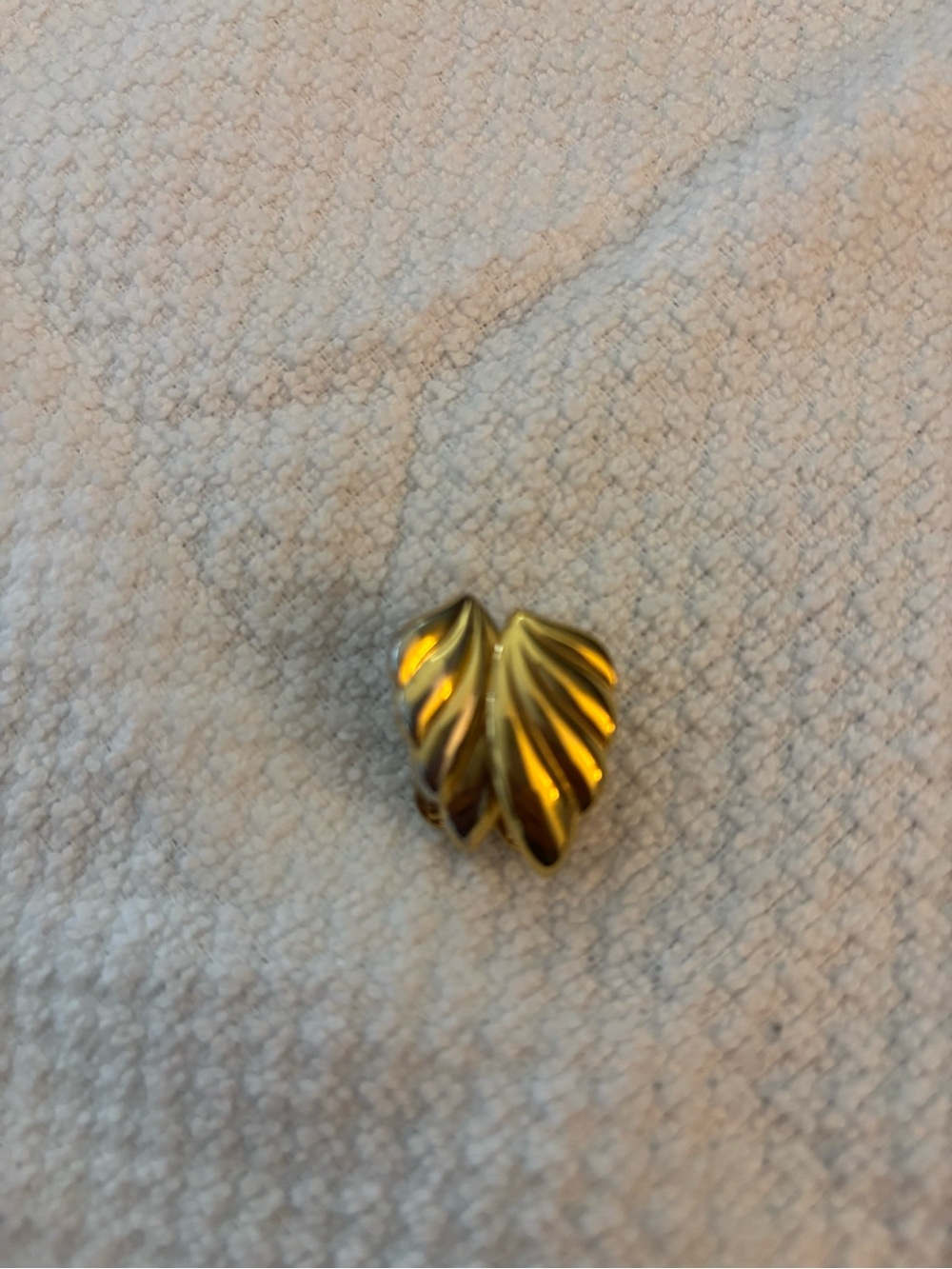 Gold clip on earring